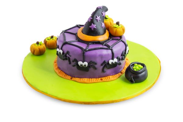 A cake decorated for halloween with spiders, pumpkins and stars.